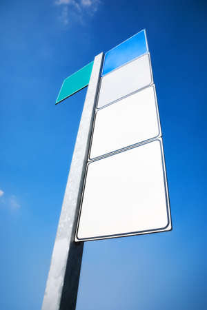 Road sign with textspace. Wide angle view and blue tint.の写真素材