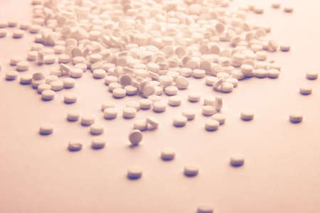 Lots of pills. Blue and yellow tint.の写真素材
