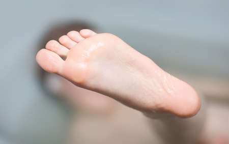 Young woman foot. Shallow dof.の写真素材