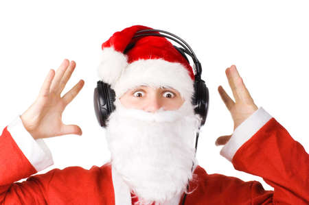 Santa listening a music. Isolated on white.の写真素材