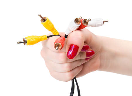 Woman hand holding tv cable pins. Isolated on white.