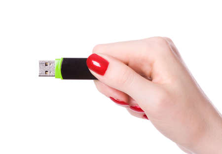 Woman hand connecting usb flash. Isolated on white.