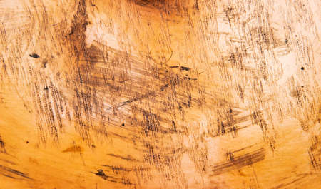 Old scratched metal texture. Red tint.の写真素材