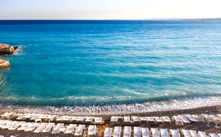 Nice beach with chaise-longue. Wide angle view.の写真素材