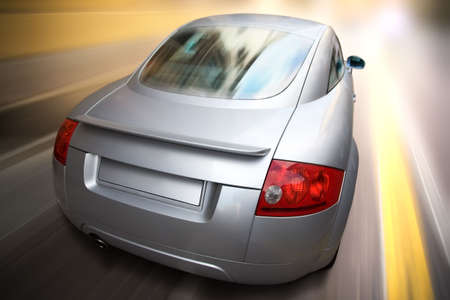 Sport car fast motion. Backside view.