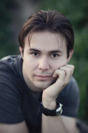 Thoughtful man outdoors portrait. Shallow dof.の写真素材
