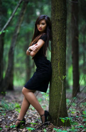 Young woman in forest. Shallow dof.の写真素材