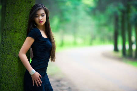 Young woman in forest. Shallow dof.の写真素材