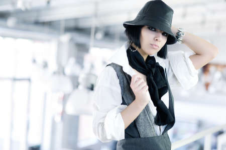 Young fashion woman with hat. Shallow dof.の写真素材