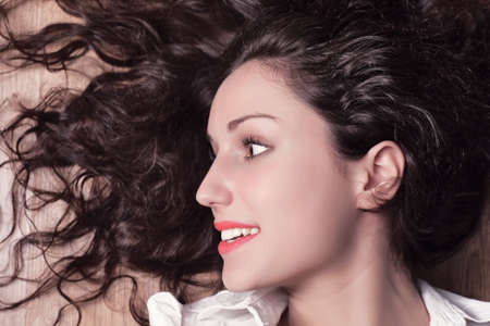 Young woman with long brunette hair portrait.