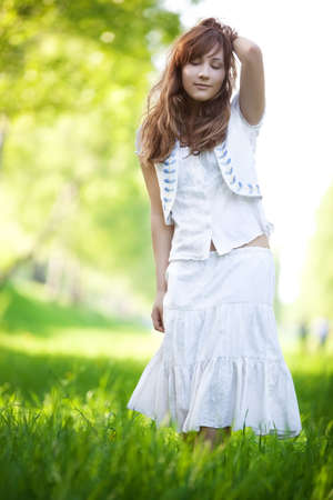 Young woman walking in a park.の写真素材