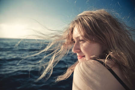 Young woman sea travel concept portrait.の写真素材