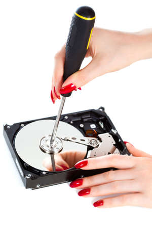 Woman repairing computer HDD. Isolated on white.