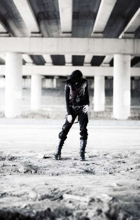 Goth woman in industrial zone. Contrast colors.の写真素材