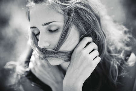 Young woman concept portrait. Soft blue tint.の写真素材