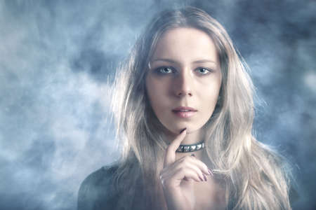 Young woman in smoke portrait.