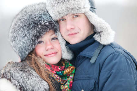 Young couple winter outdoors portrait.の写真素材