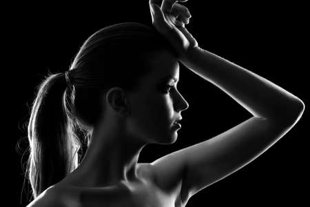Young woman elegant portrait. Black and white silhouette.の写真素材