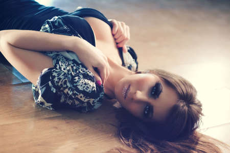 Young lying woman portrait. Soft colors and shallow dof.の写真素材