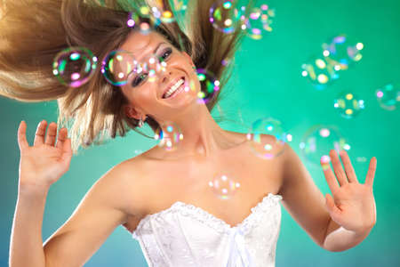 Young fashion woman with soap bubbles portrait.