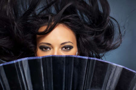 Young brunette woman stranger with fluttering hair.