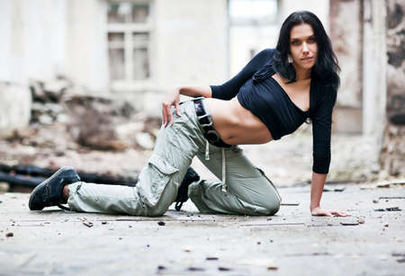 Young woman fashion in ruined building.