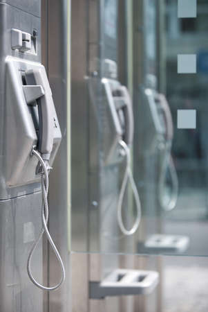 Public call box. Focus on closest phone.