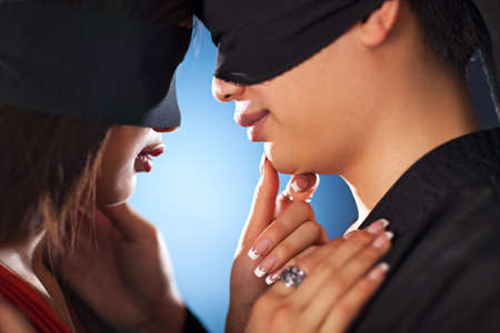 Young japan couple with bandage on eyes in love.の写真素材