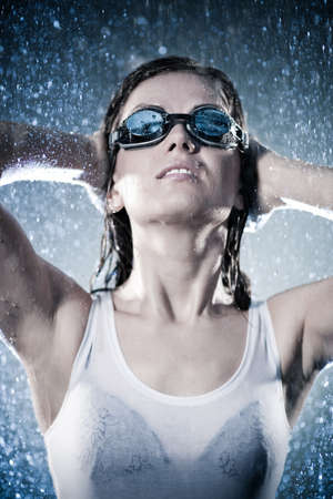 Young woman swimmer. Water studioの写真素材