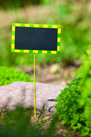 Small plate with space for text in garden.の写真素材