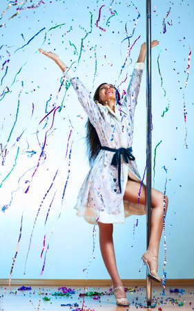 Young pole dance woman in new year clothes celebrating.の写真素材
