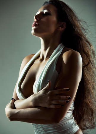 Young sexy woman portrait. Dark colors.の写真素材