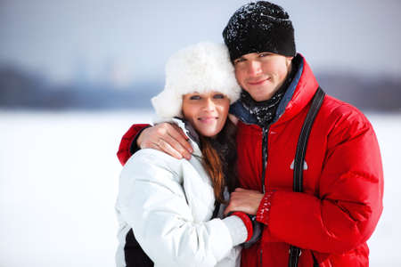 Young couple winter outdoors portrait.の写真素材
