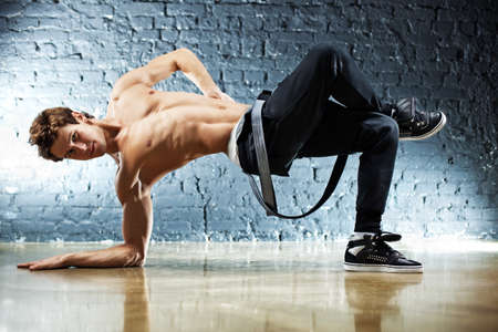 Young strong man break dance.