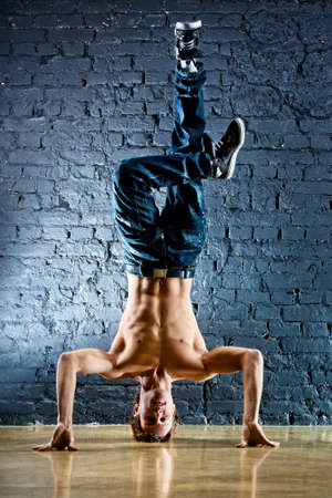 Young strong man break dance.