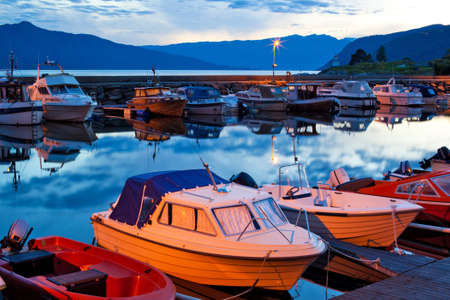 Boats on a moorage. Twilight landscape.の写真素材