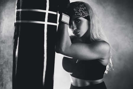 Young boxer woman portrait  Black and white film style colors 