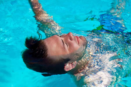 Portrait of young swimming man.