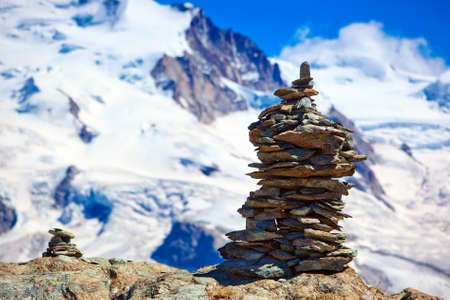 Big hand-made stone tower in Alps.の写真素材