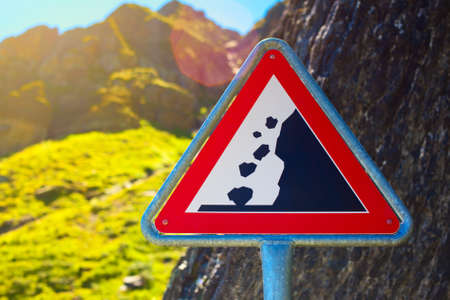 Road sign. Danger falling stones.の写真素材