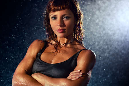 Young strong woman water portrait の写真素材