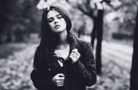 Young woman outdoors autumn portrait  Black and white colors の写真素材