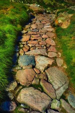 Stone path in mountains の写真素材