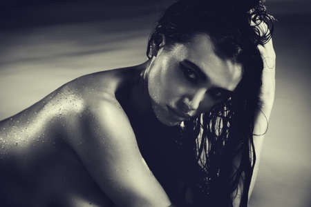 Young sexy woman water studio portrait  Film style colors の写真素材