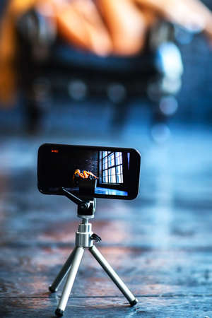 Modern mobile phone shooting video with model.の写真素材