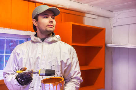 Man dyer in wooden interior.