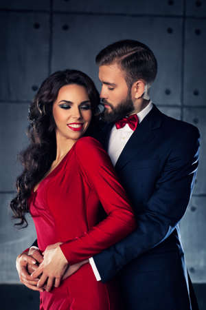 Young elegant embracing couple portrait.の写真素材