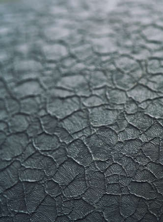 Abstract background of cracked surface. Focus on foreground.の写真素材