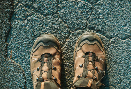 Man tourist shoes on stone surface close-up viewの写真素材