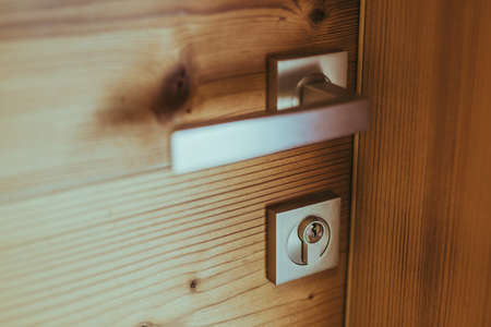 Modern wooden door and handle with lockの写真素材